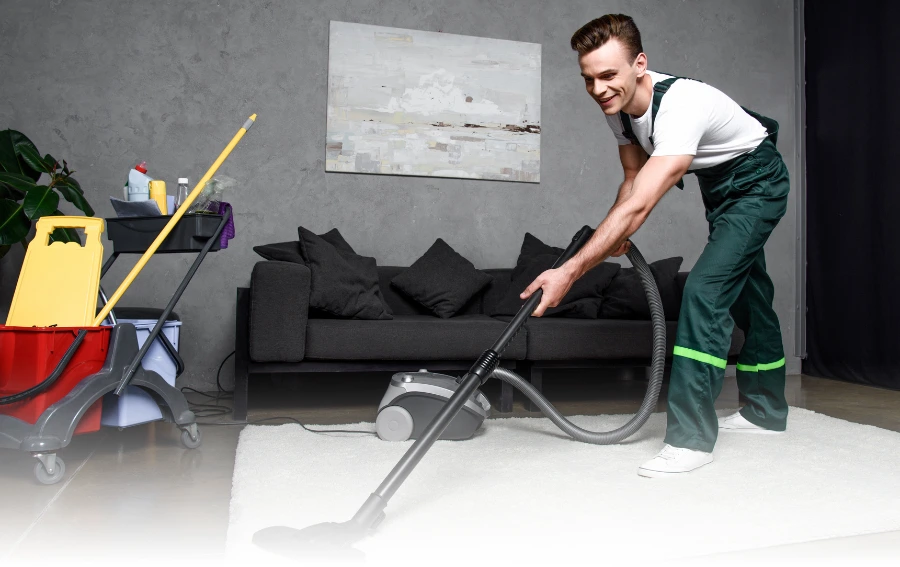 Technician Cleaning Rug with Hot Water Extraction Machine – "Professional cleaner using hot water extraction equipment on a light-colored area rug, delivering deep rug cleaning services in New Jersey."