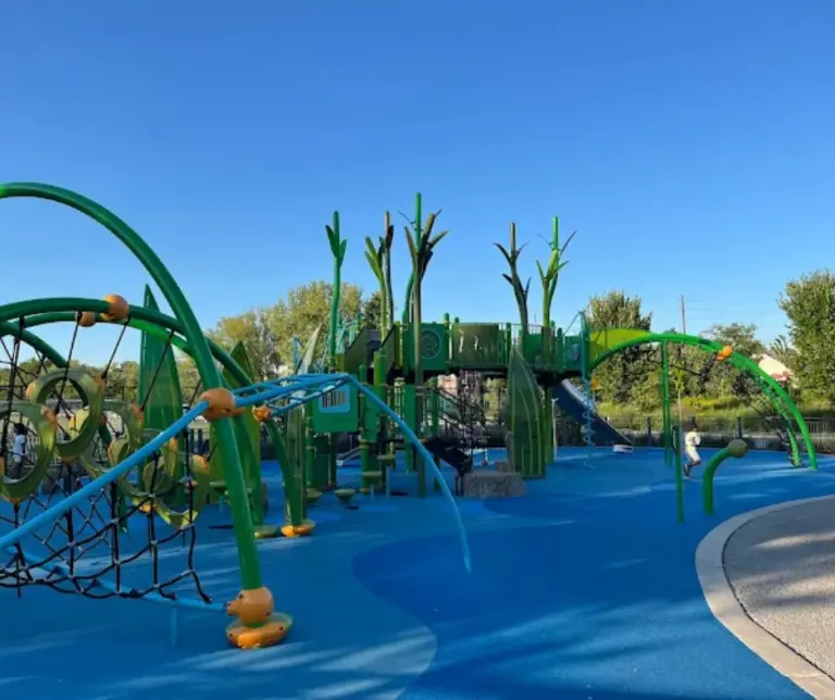 Colorful splash pad with water play structures at Dundee Island Park, located along the Passaic River and designed for family-friendly outdoor fun.